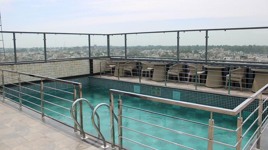 Rooftop swimming pool with city views at BluSalzz Residence, Amritsar.